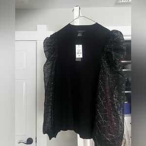 Dramatic black sweater